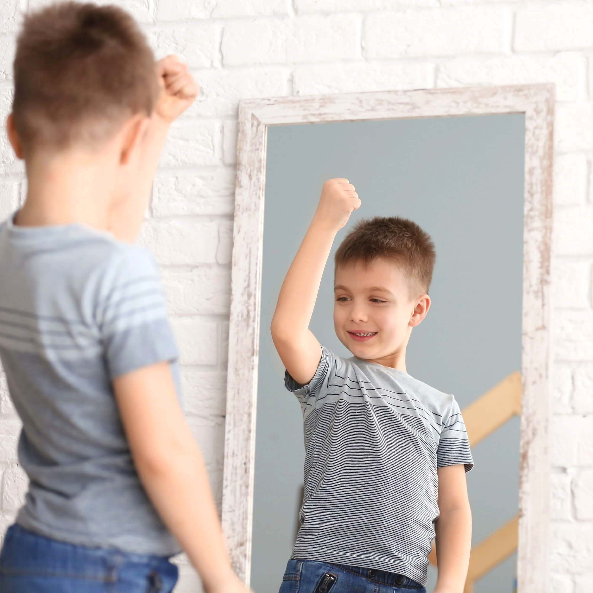mirror-cropped2 child admiring self in mirror
