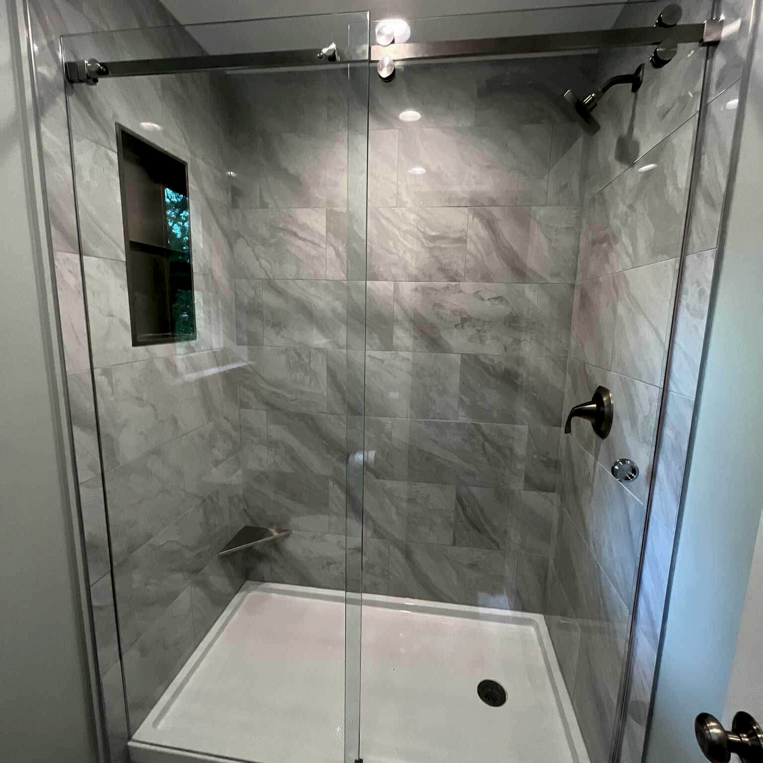 frameless glass shower door with roller sliding door system and finger pull